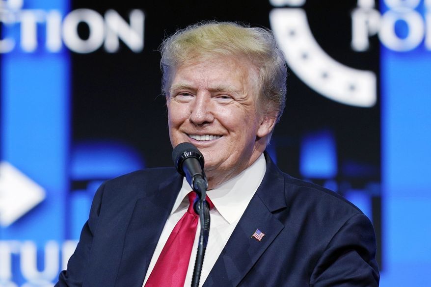 Former President Donald Trump smiles as he pauses while speaking to supporters at a Turning Point Action gathering in Phoenix, July 24, 2021. Trump has revealed he received a booster shot of the COVID-19 vaccine, drawing boos from a crowd in Dallas. Trump made the disclosure Sunday night during the final stop of “The History Tour,” a live interview show he has been doing with former Fox News host Bill O’Reilly. (AP Photo/Ross D. Franklin, File)