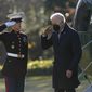 President Joe Biden salutes as he steps off Marine One on the South Lawn of the White House in Washington, Monday, Dec. 20, 2021. Biden is returning to Washington after spending the weekend at his home in Delaware. (AP Photo/Patrick Semansky)