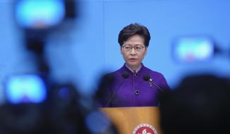 Hong Kong Chief Executive Carrie Lam listens to reporters&#39; questions during a press conference in Hong Kong, Monday, Dec. 20, 2021. Lam said during a news conference Monday that she was &amp;quot;satisfied&amp;quot; with Sunday&#39;s legislative election despite a 30.2% voter turnout, the lowest since the British handed Hong Kong over to China 1997. (AP Photo/Vincent Yu)