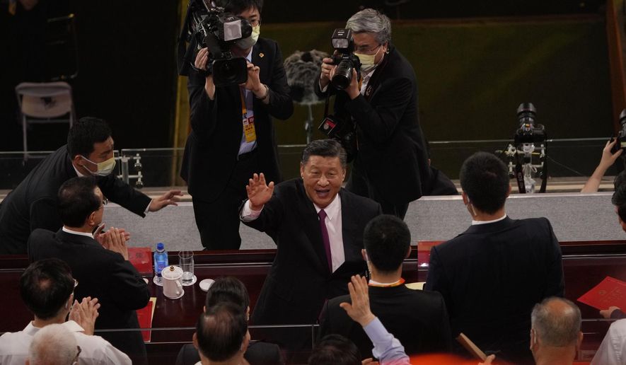 Chinese President Xi Jinping waves as he attends a gala show ahead of the 100th anniversary of the founding of the Chinese Communist Party in Beijing on Monday, June 28, 2021. (AP Photo/Ng Han Guan)