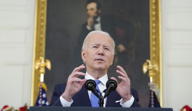 President Joe Biden speaks about the COVID-19 response and vaccinations, Tuesday, Dec. 21, 2021, in the State Dining Room of the White House in Washington. (AP Photo/Patrick Semansky)
