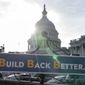 With the U.S. Capitol dome in the background, a sign that reads &quot;Build Back Better&quot; is displayed before a news conference, Wednesday, Dec. 15, 2021, on Capitol Hill in Washington. (AP Photo/Jacquelyn Martin) ** FILE **