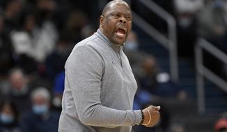 Georgetown head coach Patrick Ewing reacts during the first half of an NCAA college basketball game against Syracuse, Saturday, Dec. 11, 2021, in Washington. (AP Photo/Nick Wass)