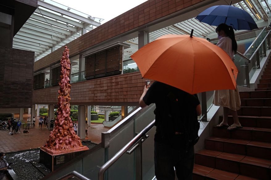 FILE - The "Pillar of Shame" statue, a memorial for those killed in the 1989 Tiananmen crackdown, is displayed at the University of Hong Kong, Oct. 13, 2021. A monument at a Hong Kong university that commemorated the 1989 Tiananmen massacre was boarded up by workers late Wednesday, prompting fears over the future of the monument as the city's authorities crack down on dissent. (AP Photo/Kin Cheung, File)