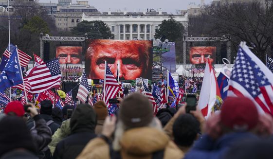 In this Jan. 6, 2021, file photo, Trump supporters participate in a rally in Washington. An AP review of records finds that members of President Donald Trump&#x27;s failed campaign were key players in the Washington rally that spawned a deadly assault on the U.S. Capitol on Jan. 6. (AP Photo/John Minchillo, File)