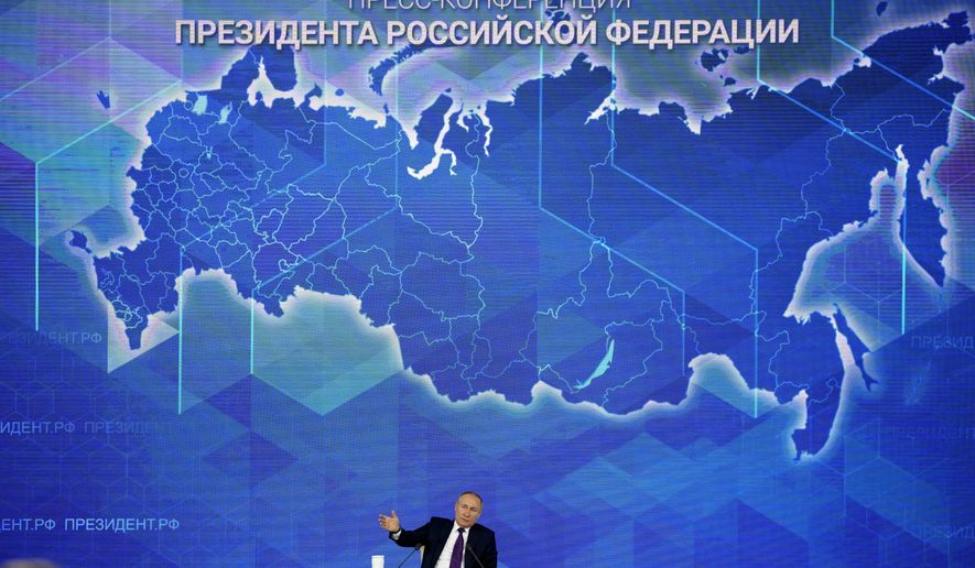 Russian President Vladimir Putin gestures while speaking during his annual news conference in Moscow, Russia, Thursday, Dec. 23, 2021. (AP Photo/Alexander Zemlianichenko)