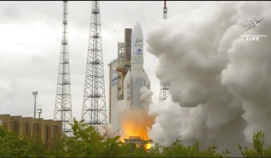 In this image released by NASA, Arianespace&#39;s Ariane 5 rocket with NASA&#39;s James Webb Space Telescope onboard, lifts off Saturday, Dec. 25, 2021, at Europe&#39;s Spaceport, the Guiana Space Center in Kourou, French Guiana. The $10 billion infrared observatory is intended as the successor to the aging Hubble Space Telescope. (NASA via AP)
