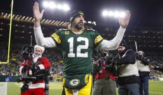 Green Bay Packers&#39; Aaron Rodgers celebrates after an NFL football game against the Cleveland Browns Saturday, Dec. 25, 2021, in Green Bay, Wis. The Packers won 24-22. (AP Photo/Matt Ludtke)