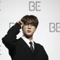 Jin, a member of South Korean K-pop band BTS, poses for photographers during a press conference to introduce their new album &amp;quot;BE&amp;quot; in Seoul, South Korea, Friday, Nov. 20, 2020. Three members of the K-pop superstar group BTS have been infected with the coronavirus.  the Big Hit Entertainment agency says in a statement that RM and Jin were diagnosed with COVID-19 on Saturday evening. It earlier said another member, Suga, tested positive for the virus on Friday. (AP Photo/Lee Jin-man, File)