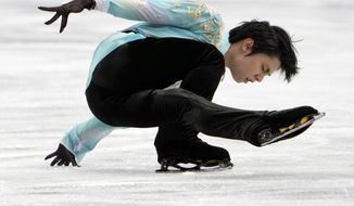 Yuzuru Hanyu of Japan performs during the men&#39;s free skating competition of the Japan Figure Skating Championships at Saitama Super Arena, in Saitama, north of Tokyo, Sunday, Dec. 26, 2021. (AP Photo/Eugene Hoshiko)