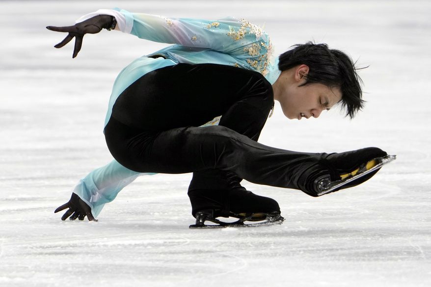 Yuzuru Hanyu of Japan performs during the men's free skating competition of the Japan Figure Skating Championships at Saitama Super Arena, in Saitama, north of Tokyo, Sunday, Dec. 26, 2021. (AP Photo/Eugene Hoshiko)