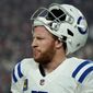 Indianapolis Colts quarterback Carson Wentz (2) looks to the bench during the first half of an NFL football game against the Arizona Cardinals, Saturday, Dec. 25, 2021, in Glendale, Ariz. (AP Photo/Rick Scuteri) ***FILE**