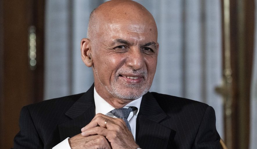 Then-Afghan President Ashraf Ghani is seated after his meeting with U.S. President Joe Biden in Washington, June 25, 2021. In an interview aired by the BBC on Thursday, Dec. 30, 2021, Afghanistan&#39;s former president recounts his final hours in office, says he had just minutes to decide to flee and denies an agreement was in the works for a peaceful takeover, disputing accounts of former government officials, Taliban and even a former U.S. negotiator. (AP Photo/Alex Brandon) **FILE**