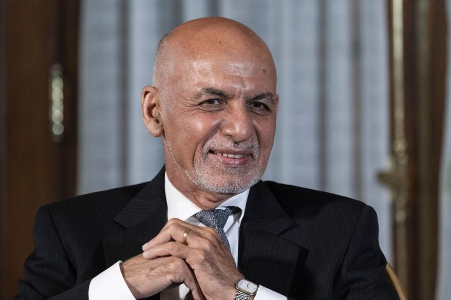 Then-Afghan President Ashraf Ghani is seated after his meeting with U.S. President Joe Biden in Washington, June 25, 2021. In an interview aired by the BBC on Thursday, Dec. 30, 2021, Afghanistan&#39;s former president recounts his final hours in office, says he had just minutes to decide to flee and denies an agreement was in the works for a peaceful takeover, disputing accounts of former government officials, Taliban and even a former U.S. negotiator. (AP Photo/Alex Brandon) **FILE**