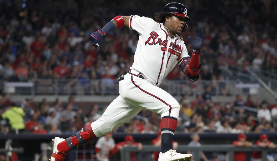 Atlanta Braves&#39; Ronald Acuña Jr. runs to first base after hitting a double during the fifth inning of the team&#39;s baseball game against the Philadelphia Phillies on Tuesday, Sept. 17, 2019, in Atlanta.   World Series champions for the first time in 26 years, the Atlanta Braves were all set to cash in. Perhaps no team was hurt more than Atlanta when Major League Baseball locked out its players on Dec. 2. The move put the start of the 2022 season in jeopardy and scrubbed Acuña and company from the Braves&#39; business plans — for now.  (AP Photo/John Bazemore, File) **FILE**