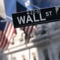 A sign for Wall Street hangs in front of the New York Stock Exchange, July 8, 2021. (AP Photo/Mark Lennihan, file)