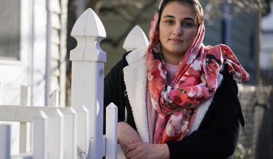 Haseena Niazi, a 24-year-old from Afghanistan, poses outside her home, Friday, Dec. 17, 2021, north of Boston. Niazi received a letter from the federal government denying her fiancé&#39;s humanitarian parole application earlier in the month. Her fiance, who she asked not to be named over concerns about his safety, had received threats from Taliban members for working on women&#39;s health issues at a hospital north of Kabul. (AP Photo/Charles Krupa)