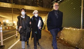 Christine Maxwell, left, Isabel Maxwell, center, and Kevin Maxwell, siblings of Ghislaine Maxwell, leave the courthouse after a verdict in New York, Wednesday, Dec. 29, 2021. British socialite Ghislaine Maxwell was convicted of luring teenage girls to be sexually abused by American millionaire Jeffrey Epstein. (AP Photo/John Minchillo)