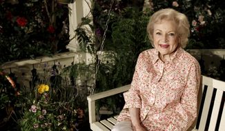 Actress Betty White poses for a portrait on the set of the television show &amp;quot;Hot in Cleveland&amp;quot; in Studio City section of Los Angeles on Wednesday, June 9, 2010.  Betty White, whose saucy, up-for-anything charm made her a television mainstay for more than 60 years, has died. She was 99. (AP Photo/Matt Sayles, File)