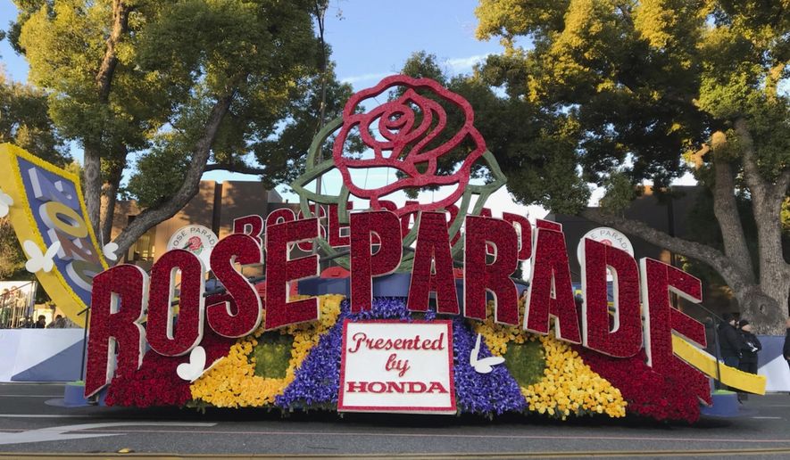FILE - In this Jan. 1, 2020, file photo, a 2020 Rose Parade float is seen at the start of the route at the 131st Rose Parade in Pasadena, Calif. The Rose Parade and Rose Bowl college football game between Ohio State and Utah were set to go forward on New Year&#x27;s Day despite surging cases of COVID-19, which forced the cancelation of the 2021 parade. (AP Photo/Michael Owen Baker, File)