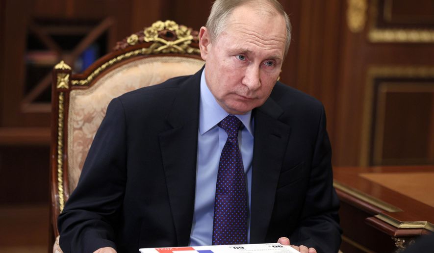 Russian President Vladimir Putin listens during a meeting in Moscow, Russia, Thursday, Dec. 30, 2021. (Alexei Nikolsky, Sputnik, Kremlin Pool Photo via AP) **FILE**