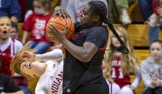 Maryland guard Ashley Owusu (15) collides with Indiana guard Nicole Cardano-Hillary (4) en route to the basket during the second half of an NCAA college basketball game, Sunday, Jan. 2, 2022, in Bloomington, Ind. (AP Photo/Doug McSchooler)