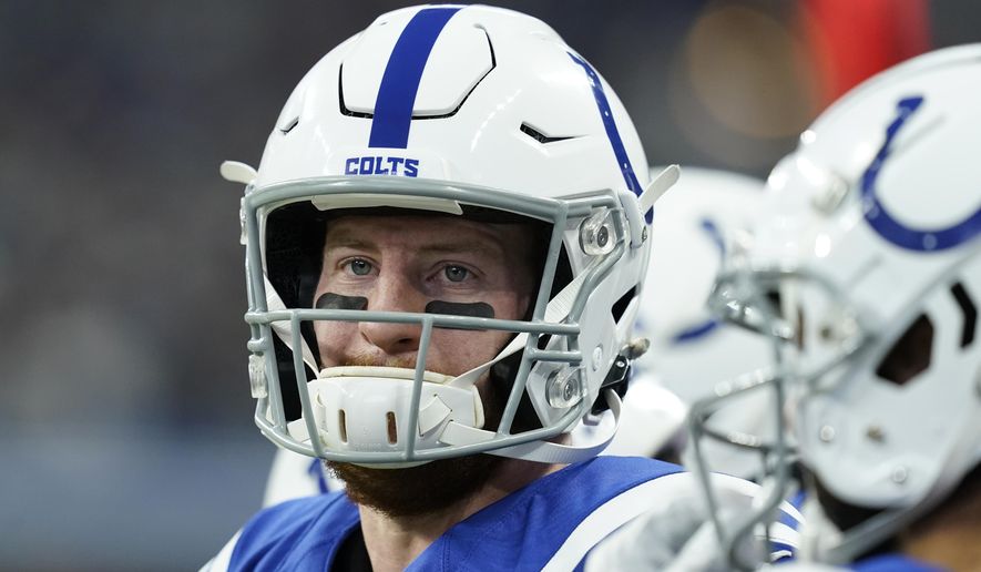 Indianapolis Colts quarterback Carson Wentz (2) stands on the sideline during the first half of an NFL football game against the Las Vegas Raiders, Sunday, Jan. 2, 2022, in Indianapolis. (AP Photo/Darron Cummings)