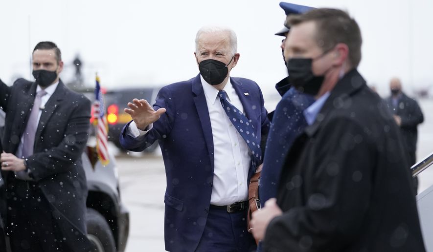 President Joe Biden arrives to board Air Force One at Delaware Air National Guard Base in New Castle, Del., Monday, Jan. 3, 2022, en route to Washington. (AP Photo/Carolyn Kaster)