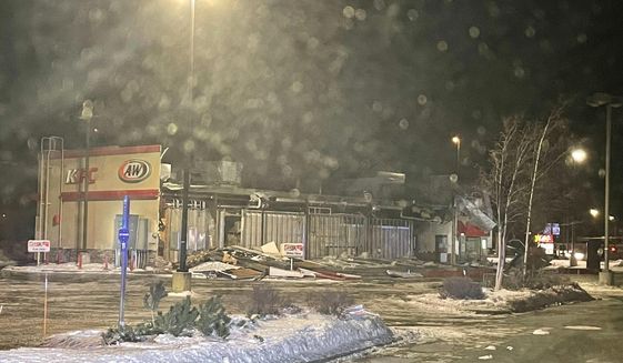 In this photo provided by the Wasilla Police Department, is a combined KFC and A&amp;amp;W fast-food building, which had one wall missing and debris piled in the drive-thru lane after a wind storm in Wasilla, Alaska on Sunday, Jan. 2, 2022. Destructive winds continued to batter an area just north of Anchorage for a third day, flipping small airplanes and semitrailers, forcing schools to close, leaving thousands without power and severely damaging a fast-food restaurant. (Wasilla Police Department via AP)
