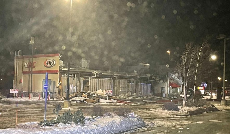 In this photo provided by the Wasilla Police Department, is a combined KFC and A&amp;amp;W fast-food building, which had one wall missing and debris piled in the drive-thru lane after a wind storm in Wasilla, Alaska on Sunday, Jan. 2, 2022. Destructive winds continued to batter an area just north of Anchorage for a third day, flipping small airplanes and semitrailers, forcing schools to close, leaving thousands without power and severely damaging a fast-food restaurant. (Wasilla Police Department via AP)