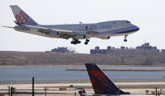 A China Airlines cargo jet lands at John F. Kennedy International Airport, Saturday, March 14, 2020, in New York. On Monday, Jan. 3, 2022, AT&amp;T and Verizon said they will delay activating new 5G wireless service for two weeks following a request by Transportation Secretary Pete Buttigieg, who cited the airline industry&#39;s concern that the service could interfere with systems on planes. (AP Photo/Kathy Willens) **FILE**