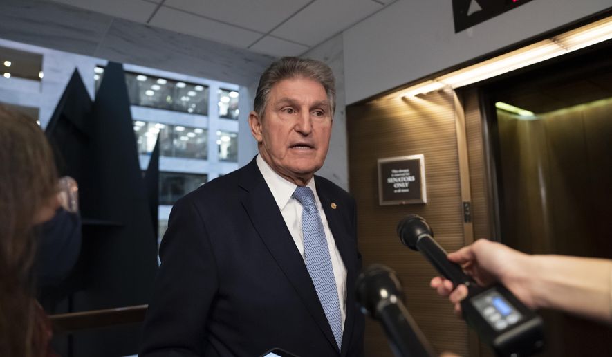 Sen. Joe Manchin, D-W.Va., leaves his office after speaking with President Joe Biden about his long-stalled domestic agenda, at the Capitol in Washington, Dec. 13, 2021. (AP Photo/J. Scott Applewhite) **FILE**