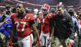 Georgia&#39;s Nick Chubb, from left, Sony Michel and Kirby Smart walk off the field as Georgia loses to Alabama in the NCAA college football playoff championship game in Atlanta on Monday, Jan. 8, 2018. Alabama won, 26-23. Those Georgia Bulldogs aren&#39;t the only ones having a devil of a time beating fellow Southeastern Conference powerhouse Alabama. (Curtis Compton/Atlanta Journal-Constitution via AP, File) **FILE**