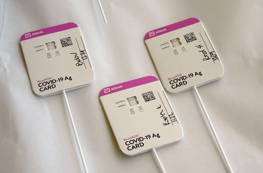 Rapid COVID-19 tests swabs are processed at Palos Verdes High School in Palos Verdes Estates, Calif., on Aug. 24, 2021. Millions of test kits were sent to families before and during winter break but millions more were not, raising concerns about public school safety now that the state's 6 million K-12 students are returning to classrooms amid soaring rates of COVID-19 cases. The California Department of Public Health has said it sent about 2 million rapid tests to school districts at the beginning of December. (Brittany Murray/The Orange County Register via AP, File)
