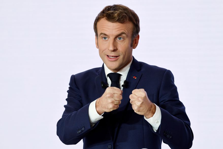 French President Emmanuel Macron gestures as he delivers a speech during a press conference on France assuming EU presidency, Thursday, Dec. 9, 2021, in Paris. President Emmanuel Macron has provoked outcries in parliament and shrill protests from election rivals by using a vulgarity to describe his strategy for pressuring vaccine refusers to get coronavirus jabs. (Ludovic Marin/Pool Photo via AP, File)