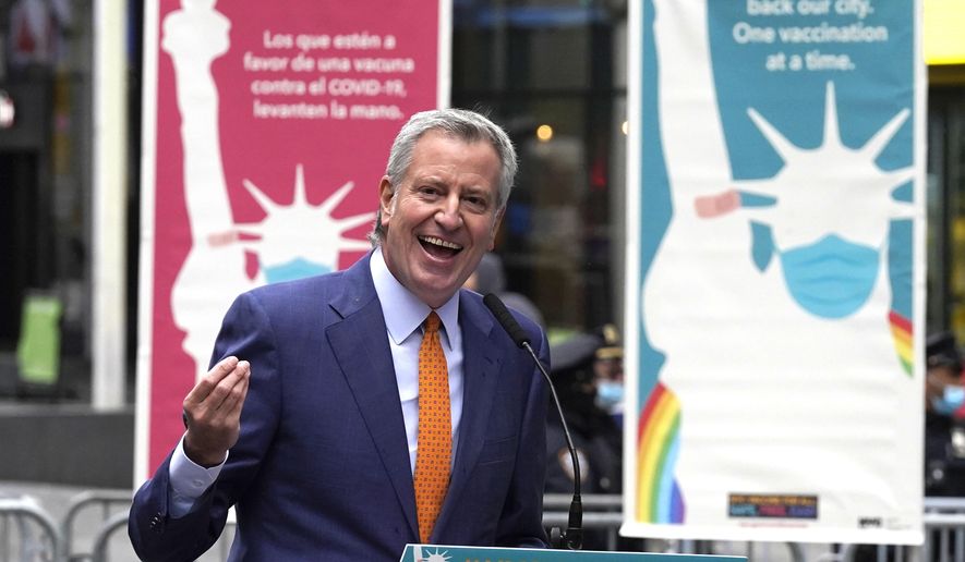 New York Mayor Bill de Blasio delivers his remarks in Times Square after he toured the grand opening of a Broadway COVID-19 vaccination site intended to jump-start the city&#x27;s entertainment industry, in New York, April 12, 2021. (AP Photo/Richard Drew) **FILE**