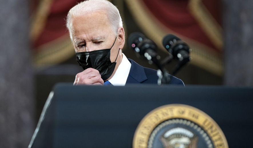 President Joe Biden pauses before speaking from Statuary Hall at the U.S. Capitol to mark the one year anniversary of the Jan. 6 riot at the Capitol by supporters loyal to then-President Donald Trump, Thursday, Jan. 6, 2022, in Washington. (Greg Nash/Pool via AP)