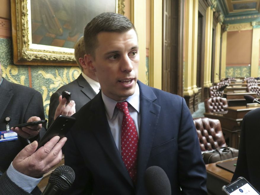 Then-Michigan House Speaker Lee Chatfield, R-Levering, speaks with reporters following the House's approval of a bill that would cut auto insurance premiums on May 9, 2019, in the Capitol in Lansing, Mich. State police in northern Michigan were investigating Thursday, Jan. 6, 2022, after a woman accused former state House Speaker Lee Chatfield of sexually assaulting her multiple times, beginning when she was about 14 years old. The accuser, now 26, filed a criminal complaint with the Lansing Police Department, which referred it to state police earlier this week. Chatfield, 33, left the House in 2020 due to term limits. (AP Photo/David Eggert, File)