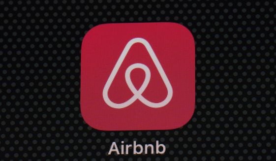 The Airbnb app icon is displayed on an iPad screen in Washington, D.C., on May 8, 2021. Airbnb hosts in Oregon will soon only see the initials of some prospective renters, not their full names, in a change designed to prevent discrimination against Black users of the online lodging marketplace.  (AP Photo/Patrick Semansky, File)