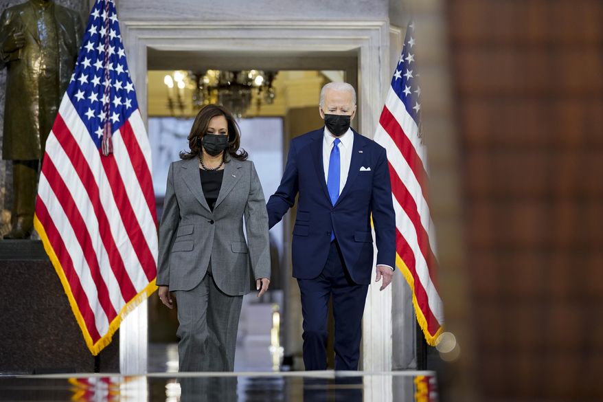 President Joe Biden and Vice President Kamala Harris arrive to speak from Statuary Hall at the U.S. Capitol to mark the one-year anniversary of the Jan. 6 riot at the Capitol by supporters loyal to then-President Donald Trump, Thursday, Jan. 6, 2022, in Washington. (AP Photo/Andrew Harnik)