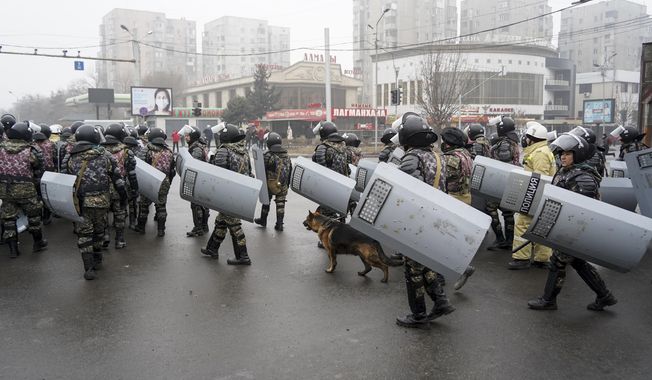 Riot police gather to block demonstrators during a protest in Almaty, Kazakhstan, Wednesday, Jan. 5, 2022. Demonstrators denouncing the doubling of prices for liquefied gas have clashed with police in Kazakhstan&#x27;s largest city and held protests in about a dozen other cities in the country. (AP Photo/Vladimir Tretyakov)
