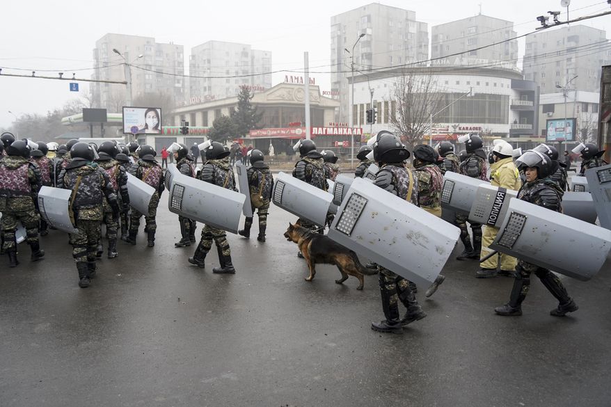 Riot police gather to block demonstrators during a protest in Almaty, Kazakhstan, Wednesday, Jan. 5, 2022. Demonstrators denouncing the doubling of prices for liquefied gas have clashed with police in Kazakhstan&#39;s largest city and held protests in about a dozen other cities in the country. (AP Photo/Vladimir Tretyakov)