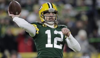 Green Bay Packers&#39; Aaron Rodgers throws during the first half of an NFL football game against the Minnesota Vikings Sunday, Jan. 2, 2022, in Green Bay, Wis. (AP Photo/Aaron Gash)