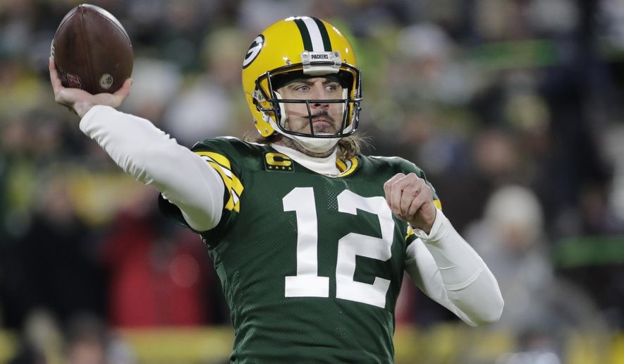 Green Bay Packers&#x27; Aaron Rodgers throws during the first half of an NFL football game against the Minnesota Vikings Sunday, Jan. 2, 2022, in Green Bay, Wis. (AP Photo/Aaron Gash)