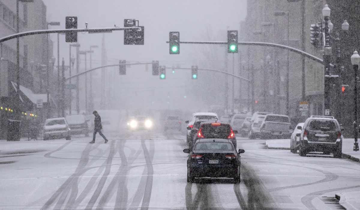 NextImg:Snow-coated roads create driving hazards around D.C. area