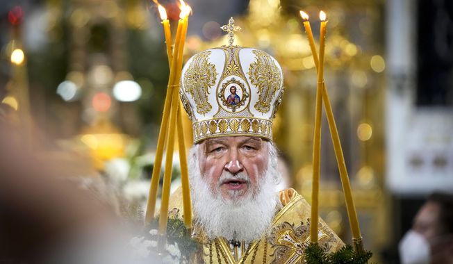 Russian Orthodox Patriarch Kirill delivers the Christmas Liturgy in the Christ the Saviour Cathedral in Moscow, Russia, Thursday, Jan. 6, 2022. Parishioners wearing face masks to protect against coronavirus, observed social distancing guidelines as they attended the liturgy Orthodox Christians celebrate Christmas on Jan. 7, in accordance with the Julian calendar. (AP Photo/Alexander Zemlianichenko)