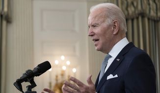 President Joe Biden speaks about the 2021 jobs report in the State Dining Room of the White House, Friday, Jan. 7, 2022, in Washington. (AP Photo/Alex Brandon)