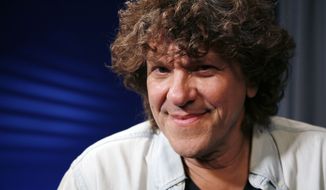 FILE - In this Aug. 13, 2009 file photo, producer Michael Lang poses for a portrait in New York. The co-creator and promoter of the 1969 Woodstock music festival that served as a touchstone for generations of music fans, Michael Lang has died. A spokesperson for Lang&#39;s family says the 77-year-old had been battling non-Hodgkin lymphoma and passed away Saturday, Jan. 8, 2022 in a New York City hospital. (AP Photo/Jeff Christensen, file)