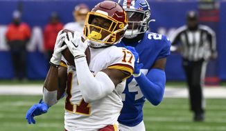 Washington Football Team wide receiver Terry McLaurin (17) catches a pass against New York Giants cornerback James Bradberry (24) during the second quarter of an NFL football game, Saturday, Jan. 9, 2021, in East Rutherford, N.J. (AP Photo/Bill Kostroun)