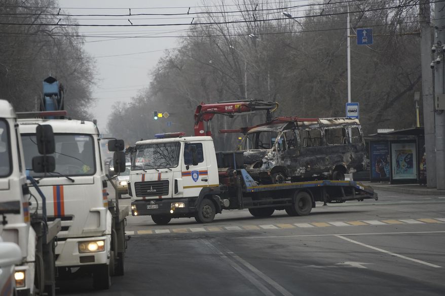 A tow truck transports a bus, which was burned during clashes in Almaty, Kazakhstan, Sunday, Jan. 9, 2022. Kazakhstan&#39;s health ministry says 164 people have been killed in protests that have rocked the country over the past week. President Kassym-Jomart Tokayev&#39;s office said Sunday that order has stabilized in the country and that authorities have regained control of administrative buildings that were occupied by protesters, some of which were set on fire. (Vladimir Tretyakov/NUR.KZ via AP)